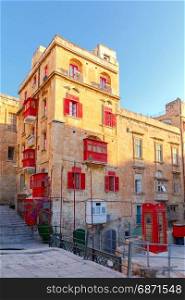 Malta. Traditional balconies on the houses.. Traditional multi-colored wooden balconies on the houses. Valletta. Malta.