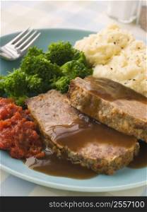 Mama&acute;s Meatloaf with Mashed Potato Broccoli Tomatoes and Gravy