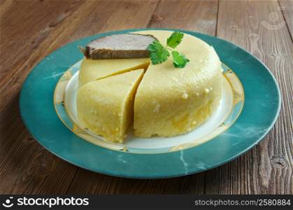 Mamaliga - porridge made out of yellow maize flour, traditional in Romania, Moldova, and Western Ukraine.