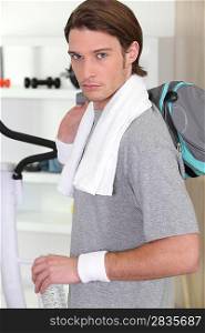 Man about to leave the gym after work-out