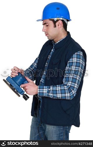 Man about to use electric sander