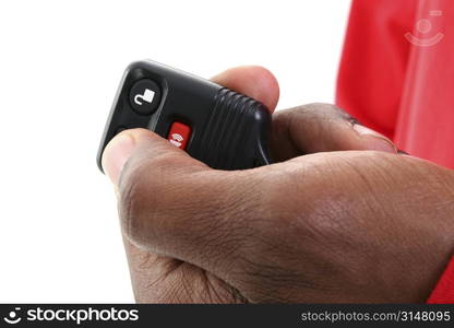 Man&acute;s hand on a keyless entry against white background.