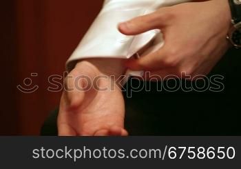 Man Adjusting Cuff Link