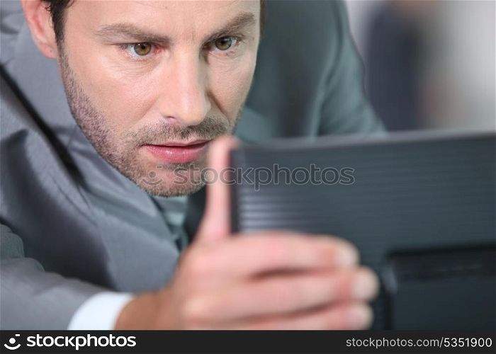 Man adjusting screen