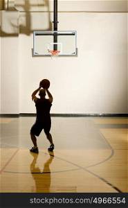 Man aiming for basketball hoop