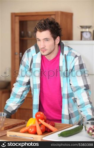 Man alone in kitchen