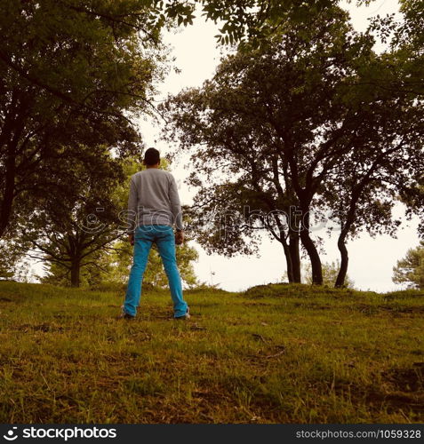 man alone in the mountain in the nature