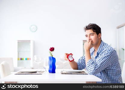 Man alone preparing for romantic date with his sweetheart