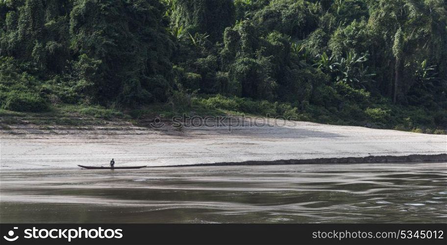 Man along side a boat in River Mekong, Sainyabuli Province, Laos