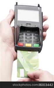 Man&amp;#39;s hand holding a bank card on POS-terminal over white