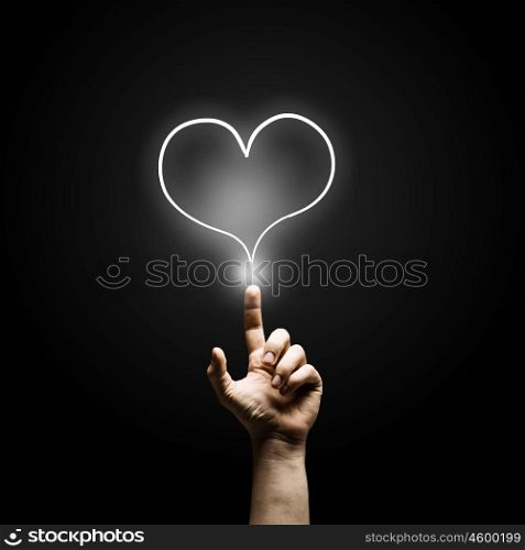 Man&amp;#39;s hand pressing heart icon button on digital touch screen