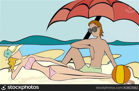 Man and a woman relaxing on the beach