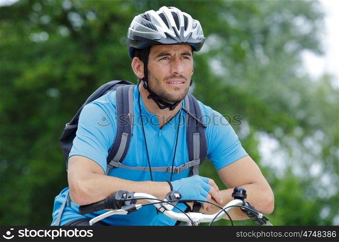 man and bike in forest