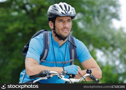 man and bike in forest