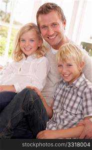 Man and children pose together