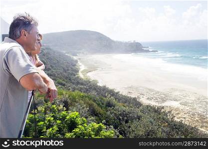 Man and Daughter Looking out at Ocean