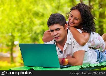 man and female using laptop