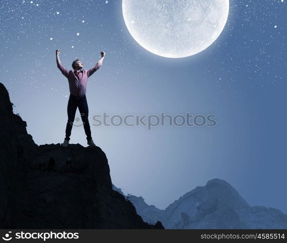 Man and full moon. Young man at night with big full moon at background