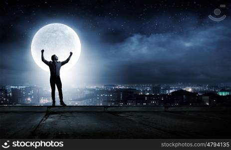 Man and full moon. Young man at night with big full moon at background