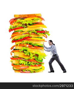 Man and giant sandwich on white