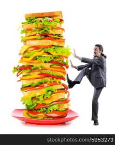 Man and giant sandwich on white