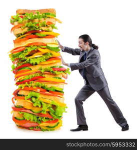 Man and giant sandwich on white