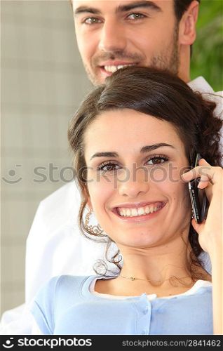 Man and girl making a call