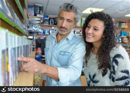 Man and lady looking at computer games