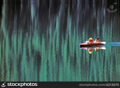 Man and Two Boys Kayaking on Stanley Lake