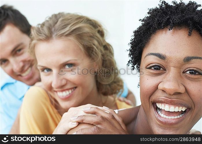 Man and Two Women Laughing