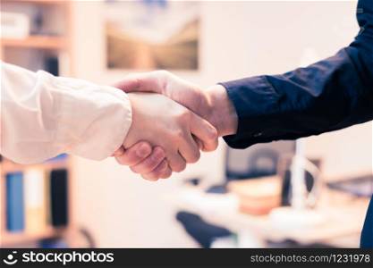 Man and woman are shaking hands, close up image, concept for human relationships