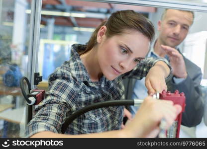 man and woman at a factory