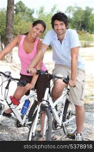 man and woman biking together