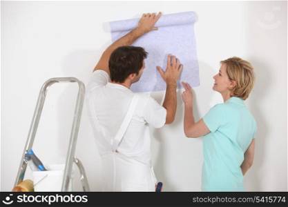 Man and woman choosing wallpaper