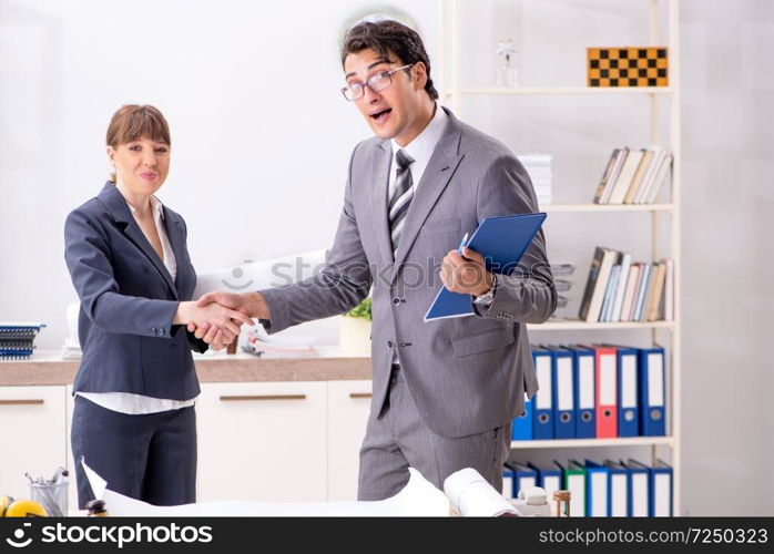 Man and woman discussing construction project