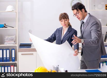Man and woman discussing construction project
