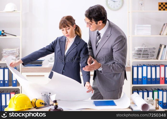 Man and woman discussing construction project