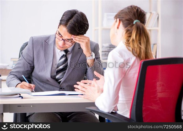 Man and woman discussing in office