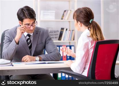 Man and woman discussing in office. The man and woman discussing in office