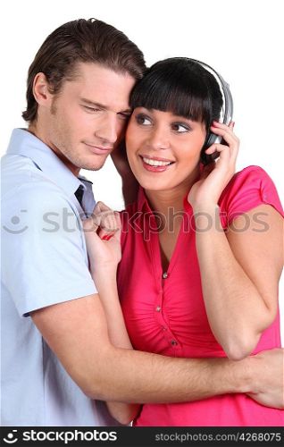 Man and woman entertaining listening to music