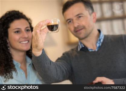 Man and woman examining coffee