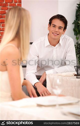 man and woman flirting in a restaurant