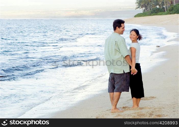 Man and Woman Hand in Hand on Beach