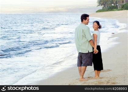 Man and Woman Hand in Hand on Beach
