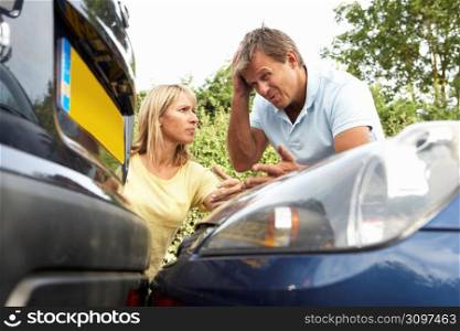 Man And Woman Having Argument After Traffic Accident