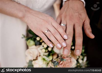 Man and woman hold hands close up. Hands of man and woman close up.. Man and woman hold hands close up