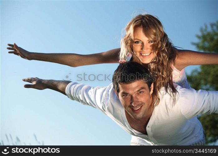 man and woman hug in the sky