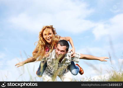 man and woman hug in the sky