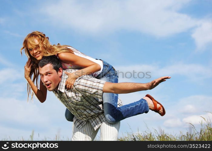 man and woman hug in the sky