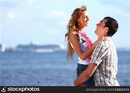 man and woman hug in the sky and sea on sea